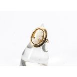 A 9ct gold cameo dress ring, the oval carved panel with a portrait of a young girl on yellow gold