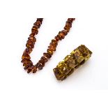 A Baltic amber knotted strung tumble polished necklace, 60cm, 78g together with a Baltic amber