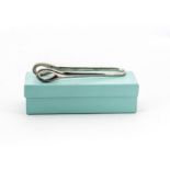 A modern pair of Tiffany & Co silver tongs designed by Peretti, in cloth case and box from Tiffany