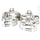 Two pairs of Victorian silver plated meat dish covers, two large and two small, each with screw