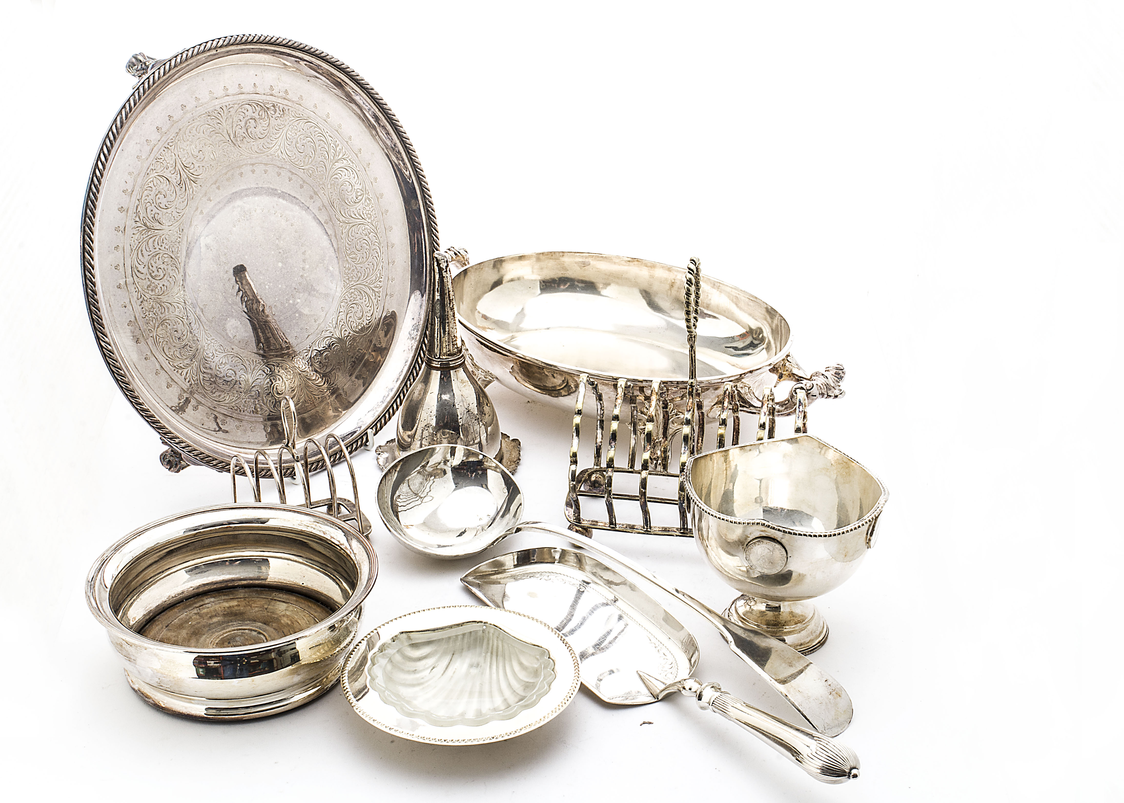 A collection of 19th & 20th Century silver plated items, including four soup ladles, a basting