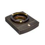 A 1980s leather and glass ashtray by Gucci, having inset amber glass ashtray in rectangular base, AF