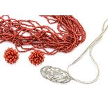 A red stained multi strung coral necklace, with matching screw back earrings, a Sterling marked