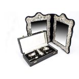 A 1980s silver fronted double photograph frame, together with a 1980s silver three piece cruet set