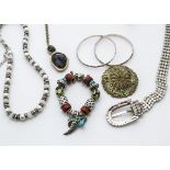 A quantity of costume jewellery, including a paste set belt, a pair of parrot wooden painted drop