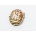 A gold framed cameo brooch, with carved decoration of the Three Graces within a scroll engraved