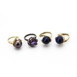 Three yellow metal dress rings, one set with black Tahitian pearl and diamond, ring size L 1/2,