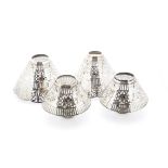 A set of five vintage silver plated pierced table lamp shades, with silver plated stands, three