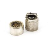 A fine 1970s silver and tigers eye table lighter from Mappin & Webb, cylindrical with bark effect