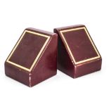 A pair of 1980s red leather and gilt bookends from Asprey