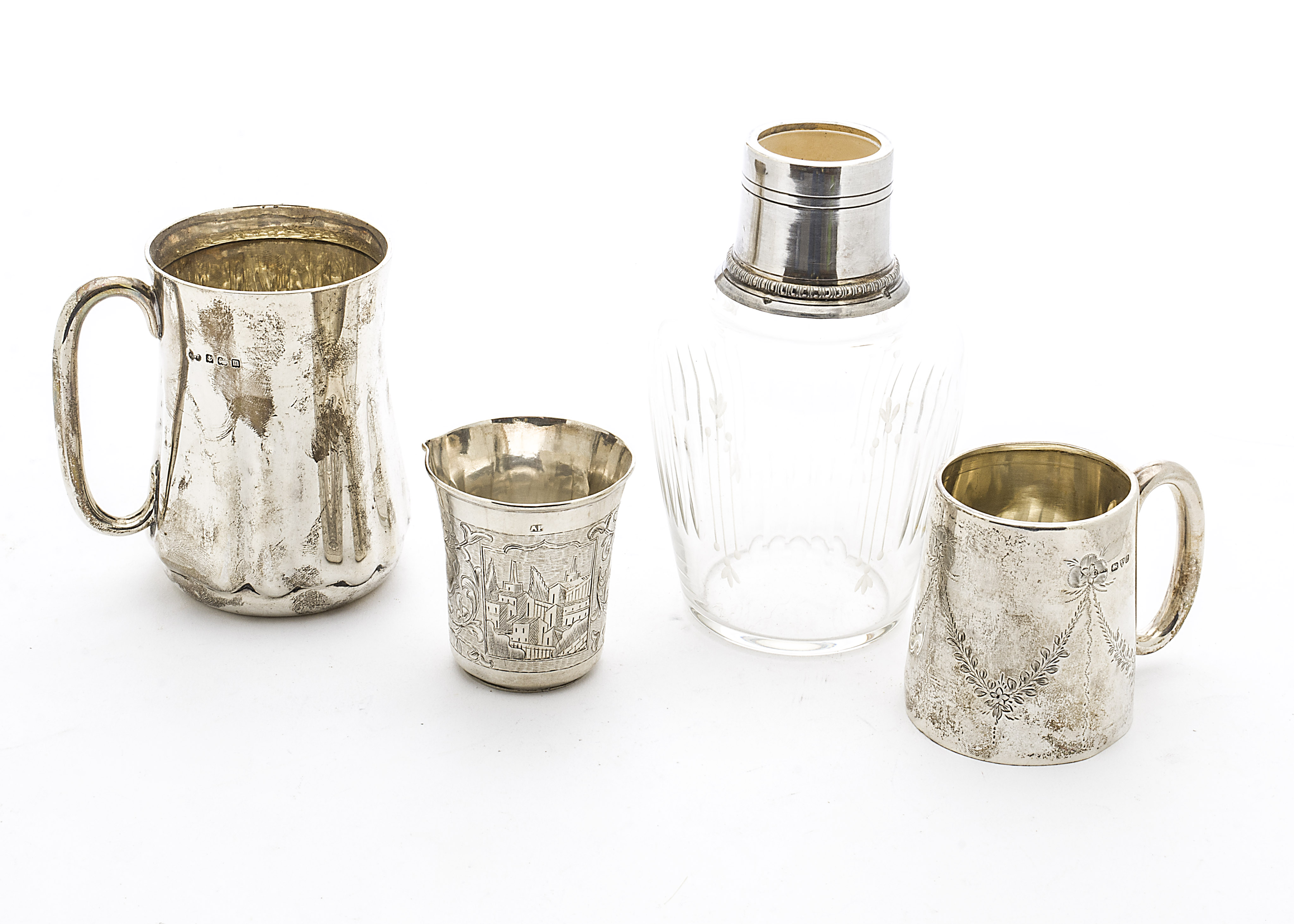 A small late 19th Century Russian silver beaker, engraved outer, now with pulled lip, Moscow Marks