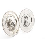 Two 1970s silver commemorative plates from John Pinches, one celebrating the Silver Anniversary of