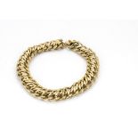 A French gold curb linked bracelet, with snap clasp and engraved design, 12g, 20cm long