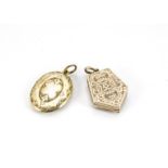 Two Victorian yellow metal lockets, one five sided example hinged to reveal two frames for portraits