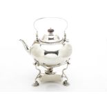 An Edwardian silver tea kettle on stand from Tessier, squat circular form with swing handle, two