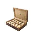 A modern walnut watch box from Dal Negro, 30cm by 20cm, opening to reveal pads for ten watches