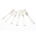 A harlequin set of eleven George III and later dinner forks and eight dessert forks, old English