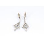 A pair of diamond platinum set and gold clip art deco style earrings, the diamond set clips