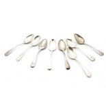 A large harlequin set of George III and later silver dessert spoons, all old English pattern with