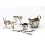 A George III silver milk jug and other items, the milk jug with possible later engraving, together