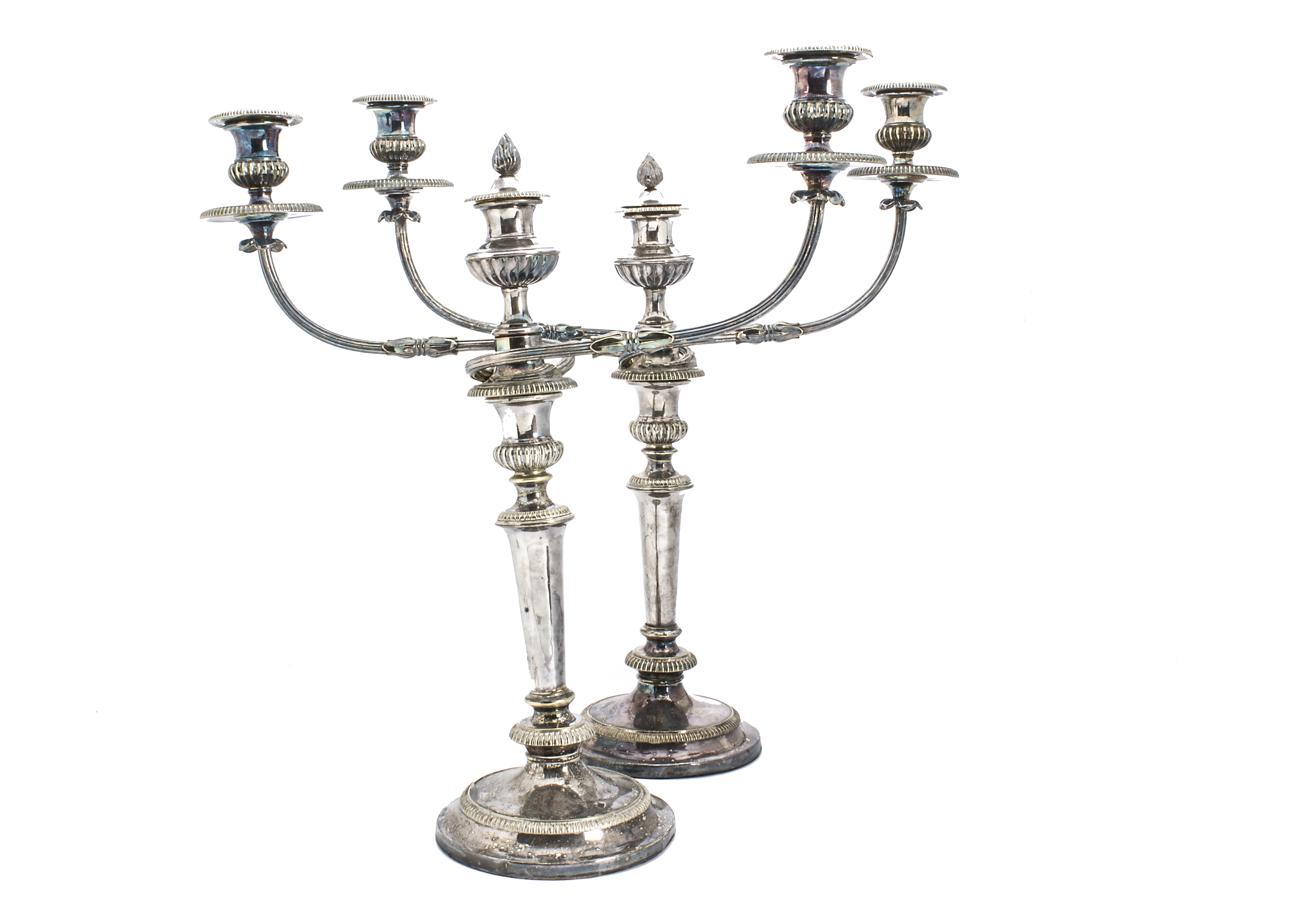 A pair of Edwardian period silver plated candelabra, twin branch on circular foot candlestick bases,