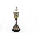 A fine 1930s silver trophy cup and cover on stand by Omar Ramsden, the Arts & Crafts style goblet