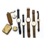 Seven watches, including a mid-sized Rigi, a Tressa, and others, also a matchbox holder and a pipe