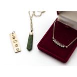 A 9ct gold rectangular ingot, 7.7g, a nephrite pendant on 9ct gold curb link chain, chain 2.4g and a