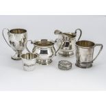 Six 20th Century white metal items, each marked sterling, including an ornate pill box, a milk jug