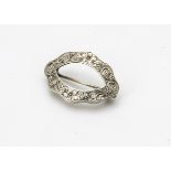 A 19th Century Tiffany & Co sterling marked oval buckle brooch, with shaped outline and engraved