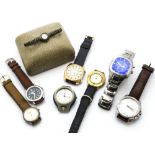 A collection of vintage and modern wristwatches, including two Fossil examples, and others such as