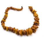 An amber graduated rough bead necklace, with screw clasp, 53cm long, 56g