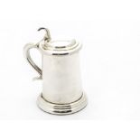 A good 1950s silver table lighter by Alfred Dunhill, in the form of a miniature tankard, dated
