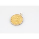 A George V full sovereign in 9ct gold mount, dated 1925, worn, 9.8g