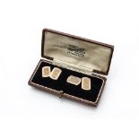 A cased pair of 9ct gold and enamel art deco cufflinks, the rectangular panels with engine turning