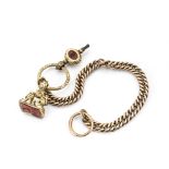 A 19th Century gold curb linked watch chain, supporting a yellow metal ouroboros split ring, a