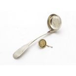 A William IV Scottish silver sauce ladle by J Mc, with engraved H to fiddle pattern handle,