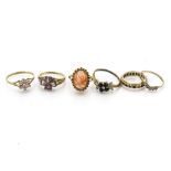 A quantity of 9ct gold gem set dress rings, including a carved coral ring, an amethyst example and