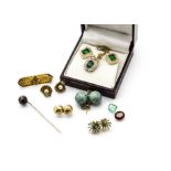 A collection of gold earrings, a gold bar brooch, an agate stick pin and a pair of simulated emerald