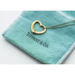 An 18ct gold Tiffany & Co Elsa Peretti open heart pendant and chain, all marked Tiffany & Co in