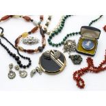 A large quantity of costume jewels, including malachite beads, coral, compacts and various others