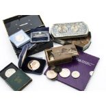 A collection of coins and medallions, including four Franklin Mint 1970s Christmas 500 grain