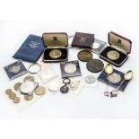 A collection of 20th Century coins and medallions, including two boxed Pobjoy Mint crowns, a Maria