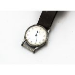 A 1920s Omega military wristwatch, chromed 32mm case, silvered dial with Arabic numerals, rear