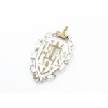 An 18th Century cut glass gold mounted Arma Christi pendant, the oval glass plaque with shaped, cut,