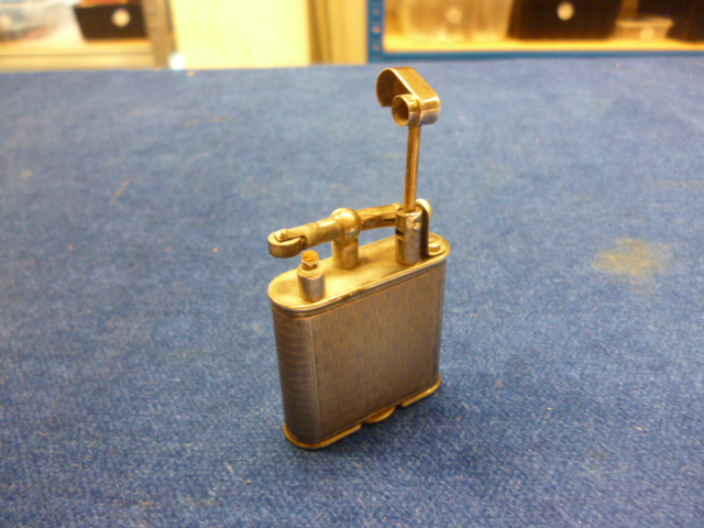 A 1920s silver cigarette lighter by Alfred Dunhill, in box, together with a similar aged 9ct gold - Image 4 of 7