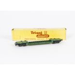 A Tri-ang TT Gauge uncommon green T173 Bogie Well Wagon, in original box, G-VG, one coupling hook