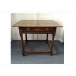 An antique oak side table, single drawer, turned supports with stretchers, 88 cm wide x 65 cm deep x