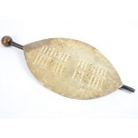 A Zulu hide dance shield, with knobkerry club, club 74 cm long