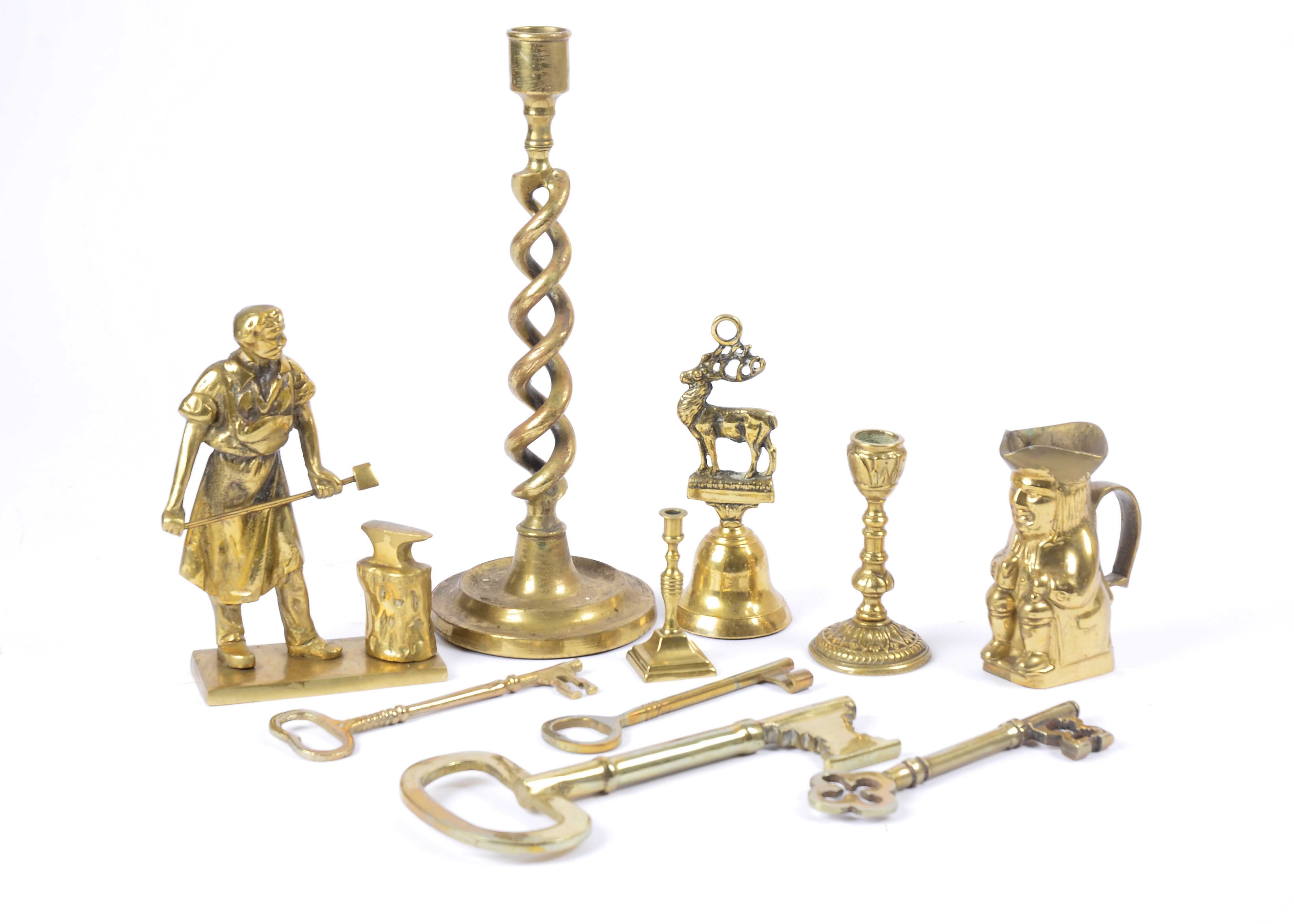 A collection of mostly 20th Century brassware, including a group of keys, a pair of candlesticks